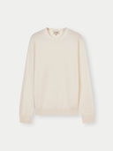 A crew neck cashmere sweater in beige color. #color_white