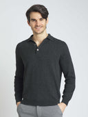 Man wearing a dark gray long-sleeve polo shirt against a light gray background #color_charcoal