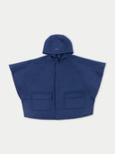 A navy blue kids' hooded cashmere poncho with a relaxed fit and multiple pockets.