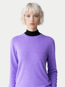 Person wearing a purple sweater over a black turtleneck on a white background #color_dusted-peri