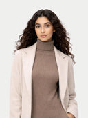Woman wearing a beige coat over a brown turtleneck dress on a white background. #color_taupe #ai-image