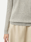 Gray sweater worn by a person on a light gray background. #color_steel-silver