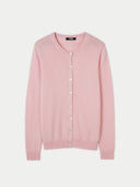 A pink crew neck cashmere cardigan with front button closure. #color_almond-blossom