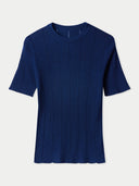 A navy blue cashmere silk top with a crew neckline and short sleeves, displayed against a plain background. #color_mood-indigo
