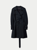 A double breasted black cashmere trench coat with a belt, collar, and cuffed sleeves. #color_black