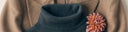 Blue cashmere long-sleeve polo shirt with two notebooks tucked under the sleeve