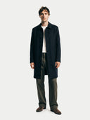 Man wearing a dark coat on a white background. #color_black #ai-image