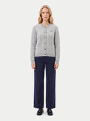 The Cashmere Cable-Knit Crew Neck Cardigan, shown worn.