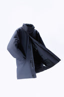 A navy CashmereTech puffer jacket floating against a white background