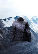 A black CashmereTech puffer jacket against snow-covered mountains