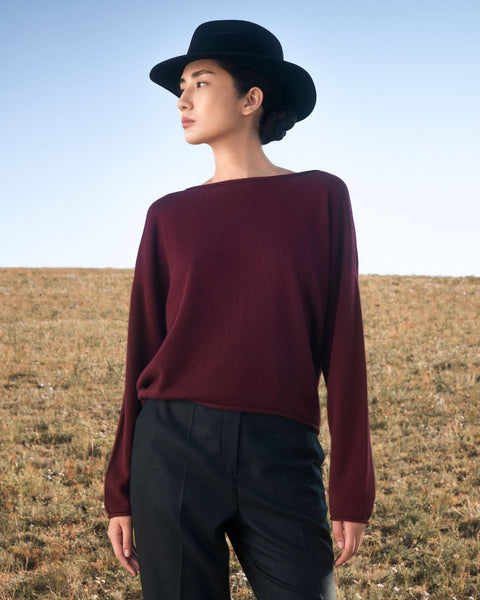 Seamless Cashmere Rolled-Edge Boat-Neck Jumper in Morning Green, editorial photo