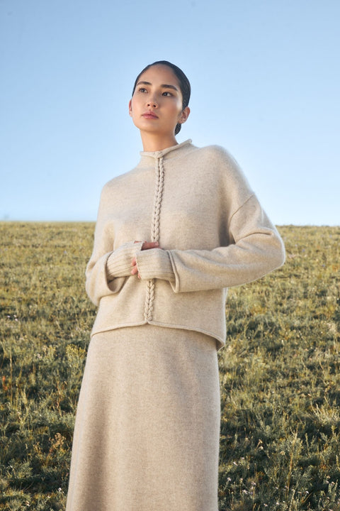 Cashmere Braided-Cable High-Neck Jumper in Taupe, editorial photo