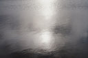 Light reflecting on the rippled surface of clean water