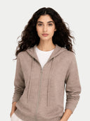 Woman wearing a brown zip-up hoodie on a white background. #color_taupe #ai-image