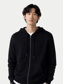 Person wearing a black hoodie against a white background. #color_black #ai-image