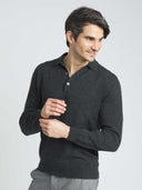 Man wearing a dark gray sweater against a plain background