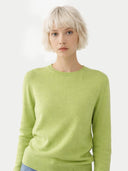 Person wearing a light green sweater on a white background #color_jade-lime
