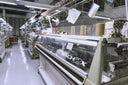 Rows of Shima Seiki MACH2X knitting machines in GOBI's knitting factory