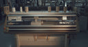 A Shima Seiki MACH2X wholegarment knitting machine with cones of cashmere yarn