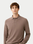 Man wearing a brown long-sleeve polo shirt against a white background