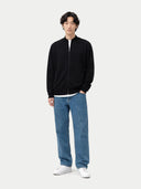Person wearing a black zip-up hoodie, blue jeans, and white sneakers on a white background. #color_black #ai-image