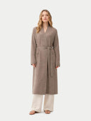 Woman wearing a long brown robe on a white background. #color_taupe #ai-image