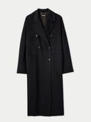 A double-breasted long coat in black, with wide notch lapels and sustainably-produced buttons, displayed on a mannequin. #color_black