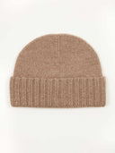 A beige rib knit hat made of cashmere, displayed against a neutral background.